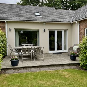 freepik__please-give-me-a-photo-of-a-house-with-a-dull-pati__58509